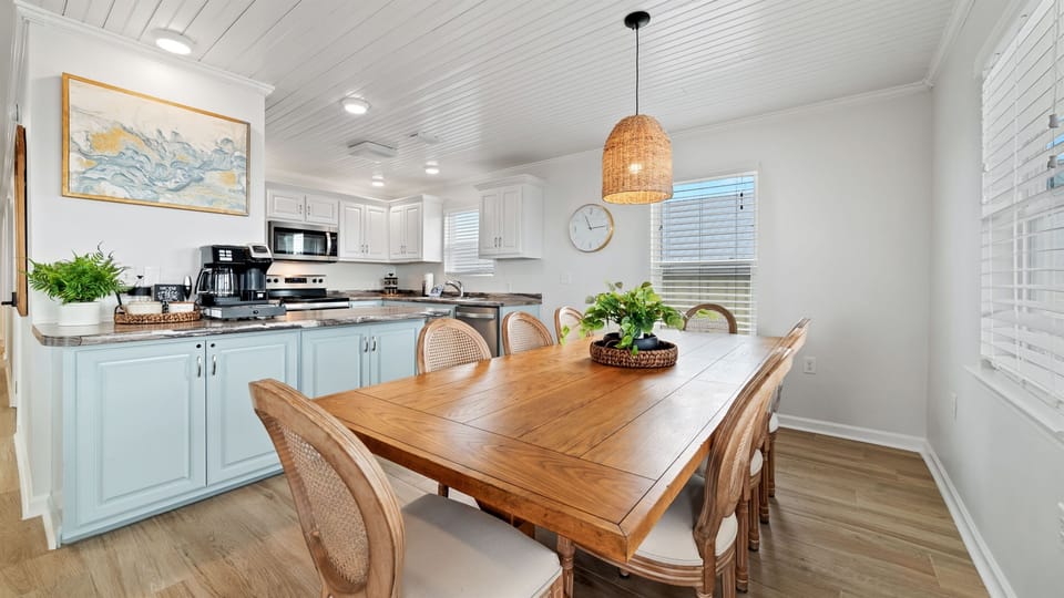 Right after the living space, you’ll find our spacious dining table, comfortably seating eight!
