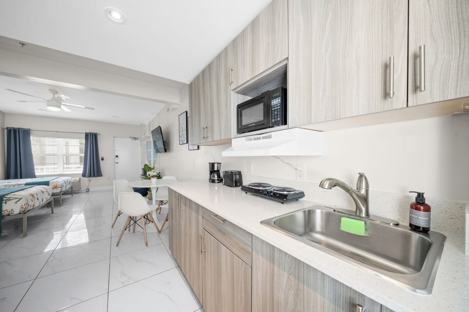 Premium Two Double Beds Studio w/ Kitchen | Private kitchenette | Full-size fridge, microwave, stovetop, coffee/tea maker