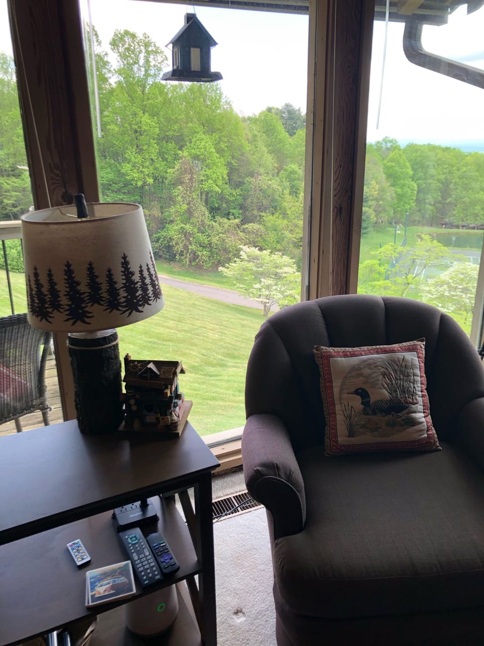 Curl up with a book and enjoy the floor to ceiling view of the seasons.