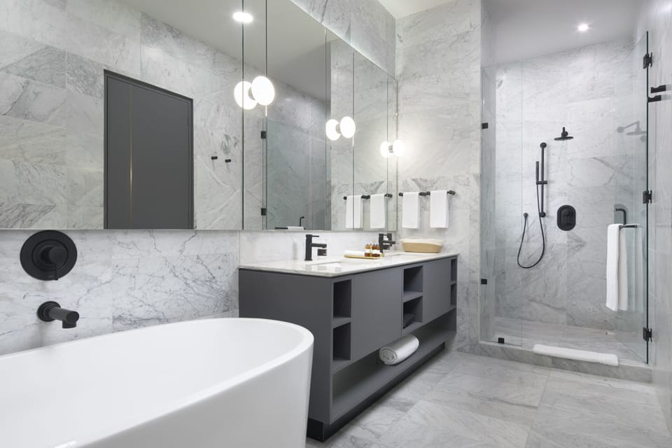 Exquisite Apartment | Bathroom | Separate tub and shower, designer toiletries, hair dryer, towels