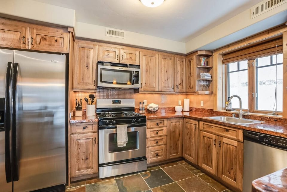 Easily prep meals in the full size kitchen stocked with essentials. 
