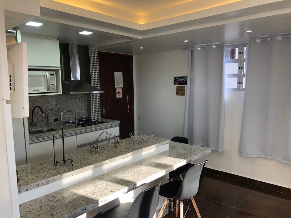 Deluxe Apartment, Multiple Beds | Private kitchen | Microwave, toaster, cookware/dishes/utensils