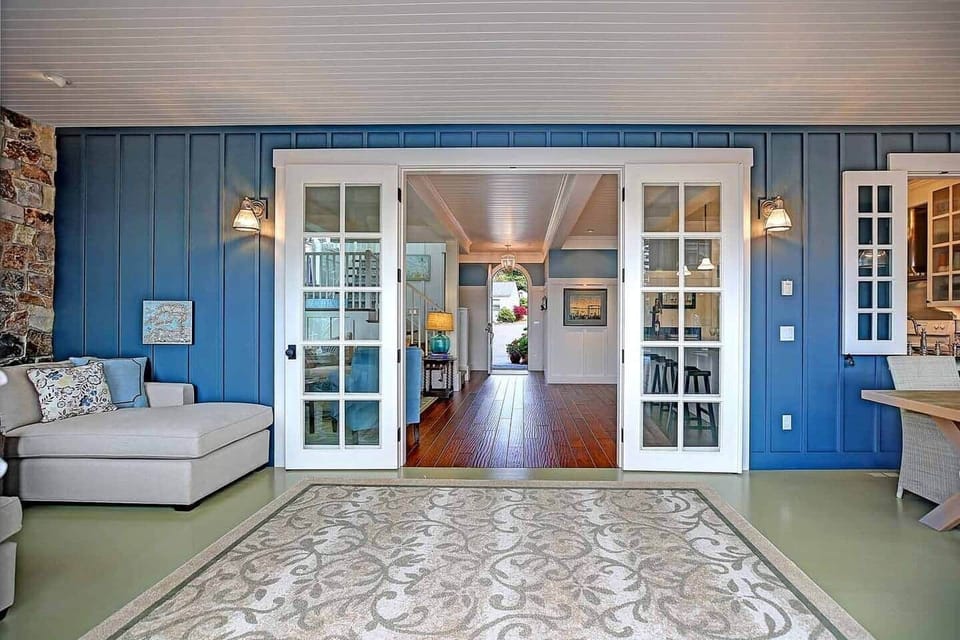 The sun room is where we honestly spend most of our time when we're not outdoors. It has easy access to the pool deck and to the kitchen, and is heated by a gas fireplace.