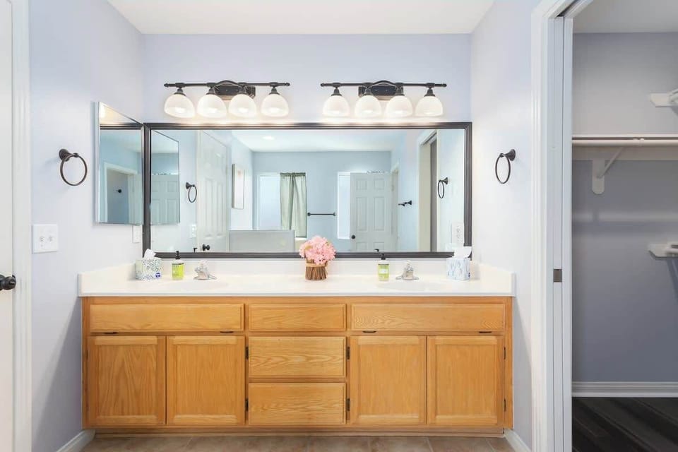 His and her vanity mirror, a luxurious bathtub, shower, thoughtful accents, plus towels and toiletries to complete your bathroom experience to either start or end your day here.
