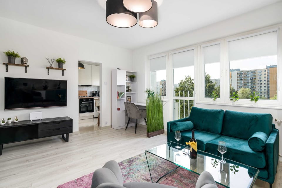 A spacious open-plan living and dining area with elegant decor and a comfortable layout.
