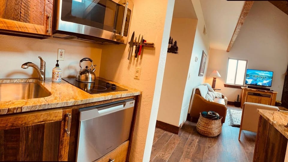 full kitchen with stove, microwave/conventional oven, dishwasher. The pantry is across full of spices and essentials. Fully stocked 