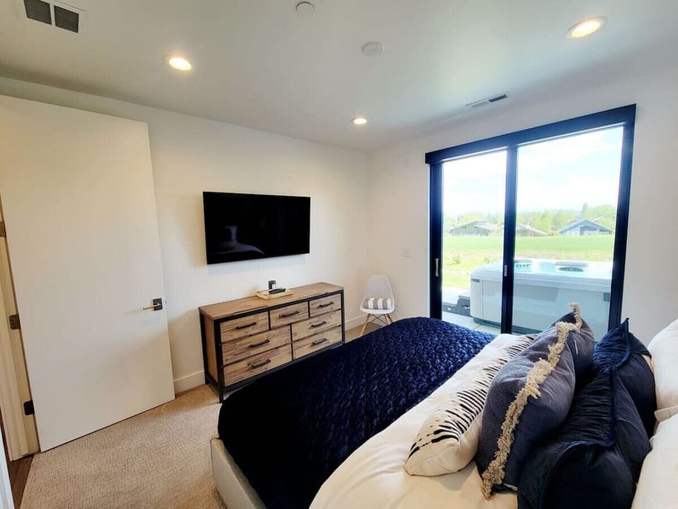 King bedroom with walk out to hot tub`