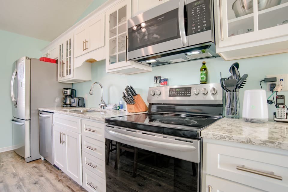 Fully stocked kitchen with stainless steel appliances! 
