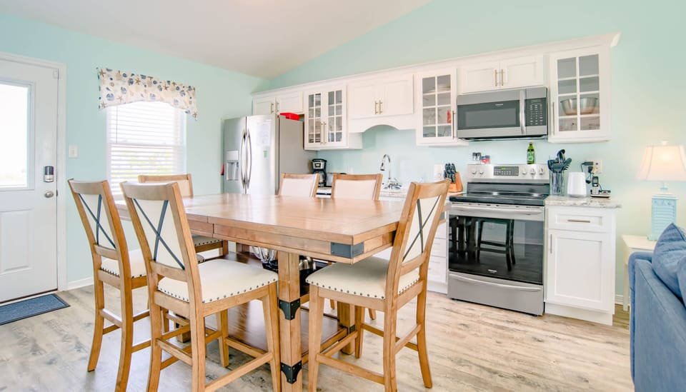 This eat-in dining offers enough seating for everyone to enjoy a meal or cards!