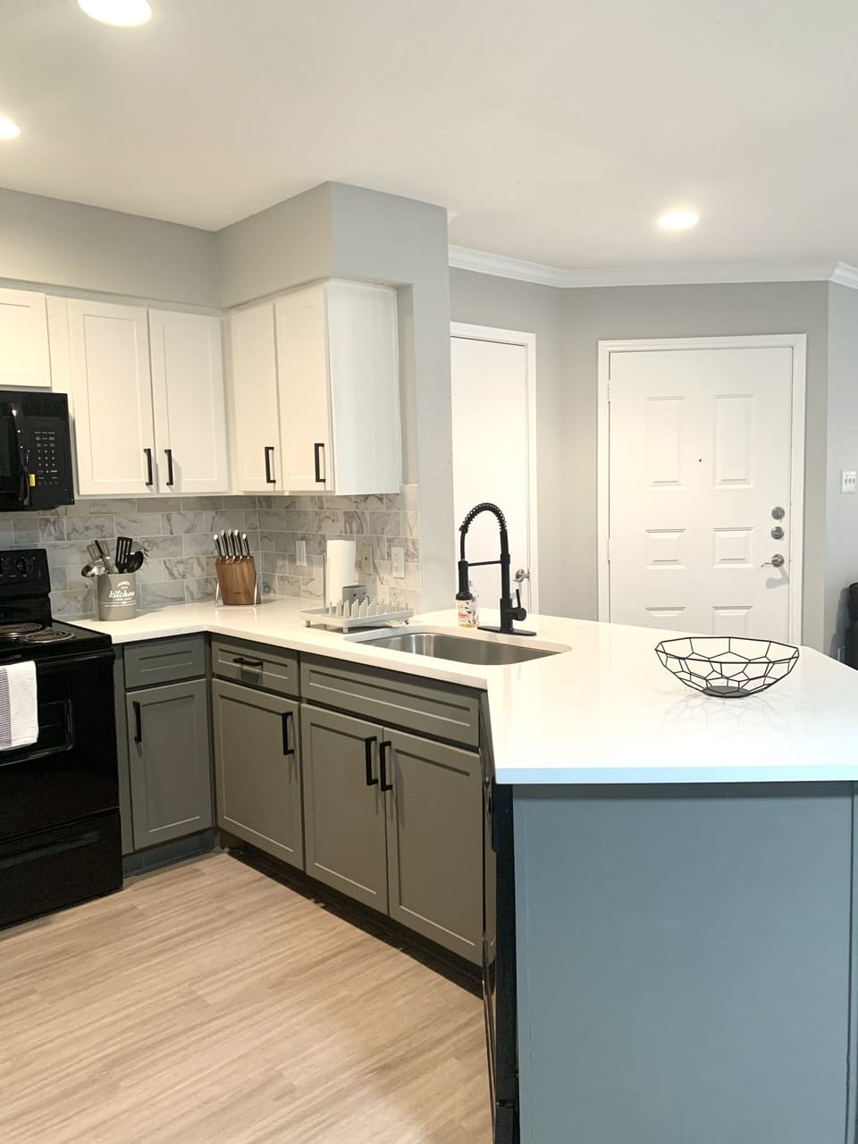 Modern kitchen with clean lines and granite countertops.