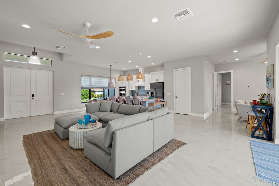 The living room has comfortable seating & a flat-screen TV