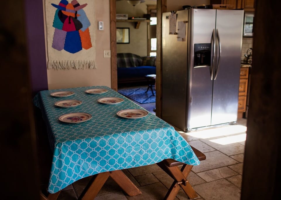 The kitchen is updated with granite counters & heated travertine floors.