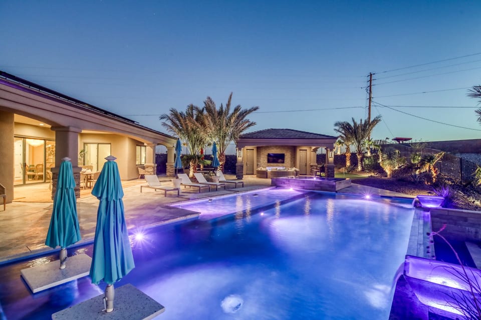 Overlooking the lounging area in the pool back toward the spa and cabana. 