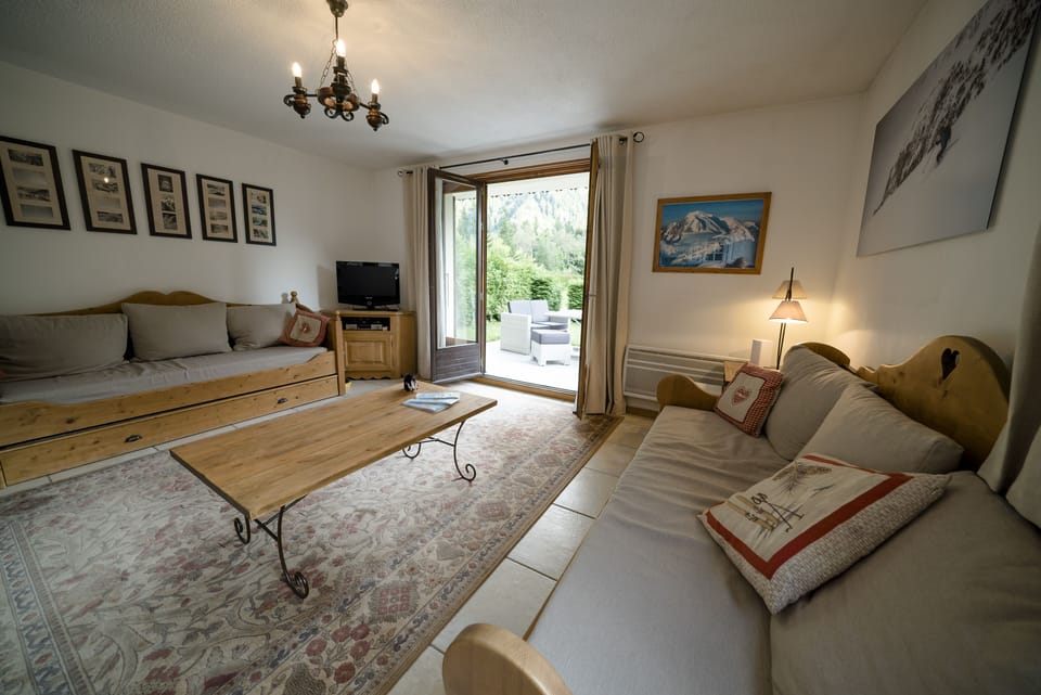 Lounge has two three seater sofas and double doors into private garden.
