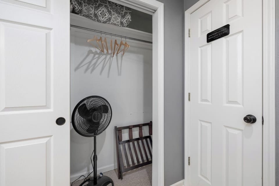Storage Space: Convenient closet with a fan and extra hangers for all your vacation essentials!