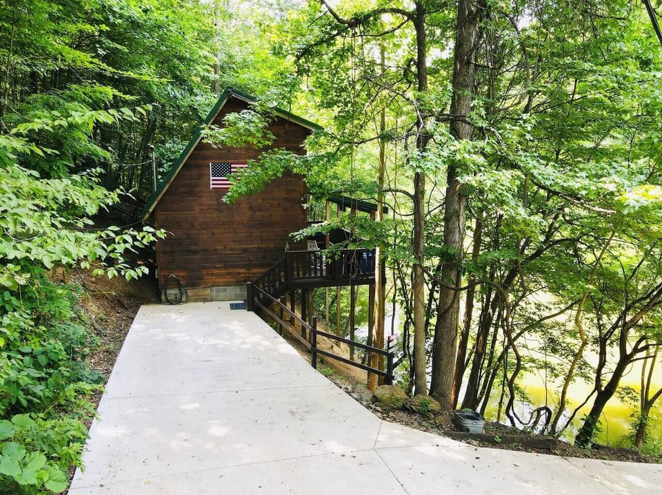 Escape to Leona’s Cabin with tranquil pond views and secluded outdoor relaxation 
