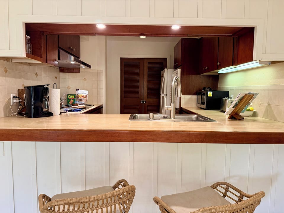 Two barstools looking into kitchen.