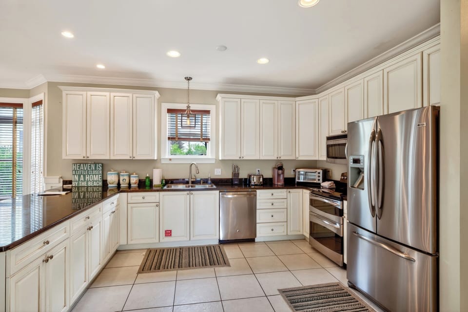 Spacious kitchen with stainless steel appliances, ample counter space, and everything you need for easy meal prep.