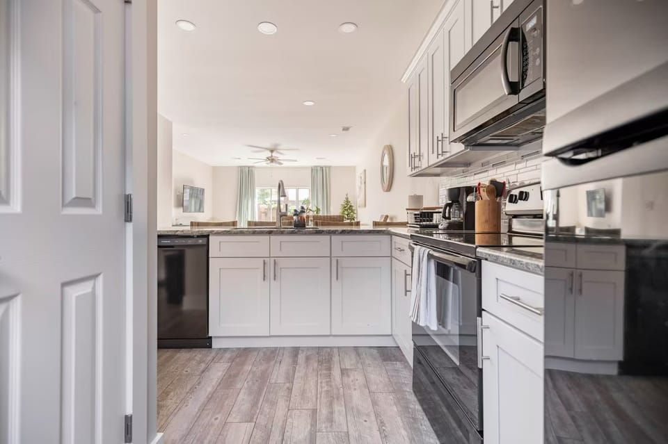Fully stocked kitchen with coffee machine, espresso machine, blender, toaster…