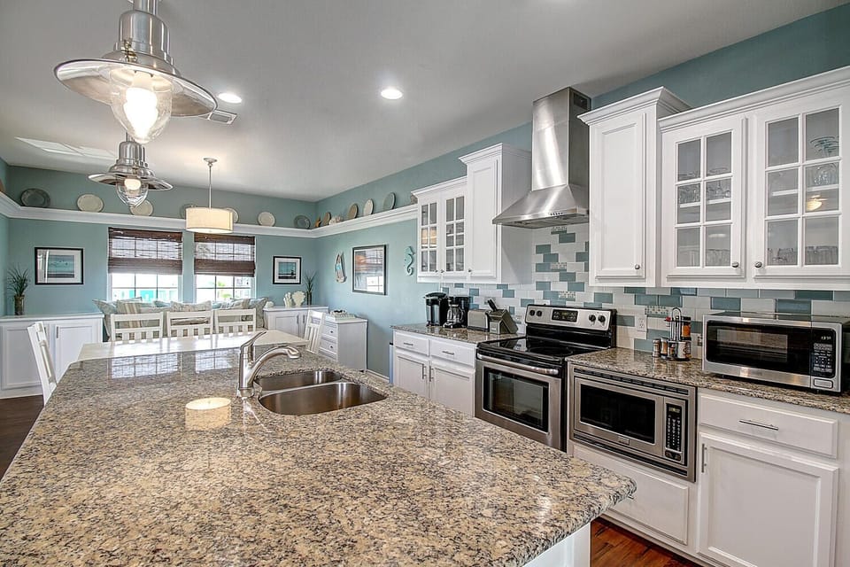 Your gourmet kitchen awaits with granite countertops, stainless appliances, and a breakfast nook where morning coffee feels like vacation.