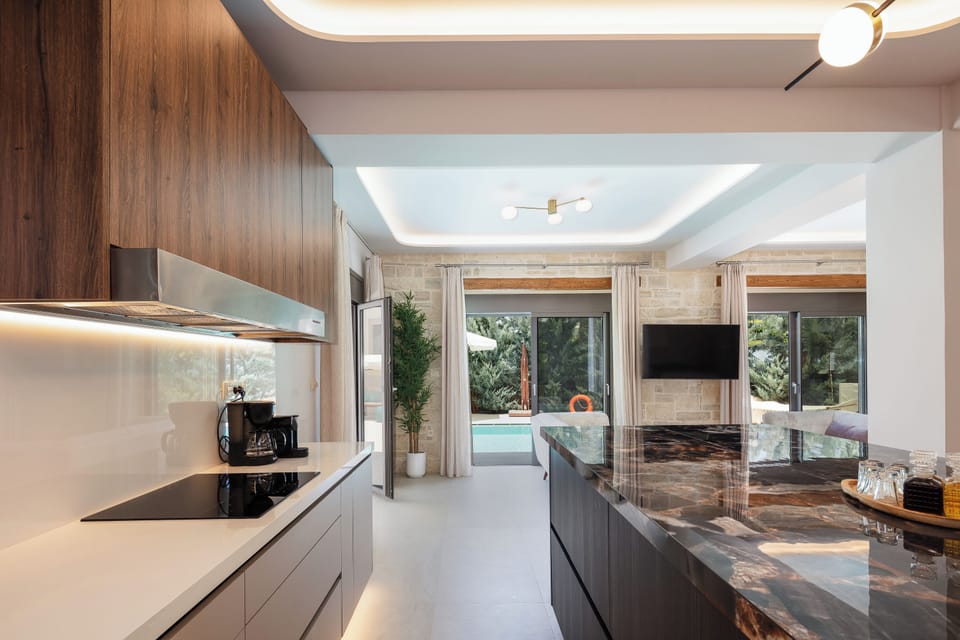 It has four ceramic hobs, a refrigerator, an electric oven, and a microwave oven and a wine cooler, offering a unique dining experience for all meal