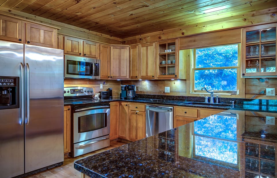 Fully Stocked Kitchen Overlooking Beautiful Canopied Trees