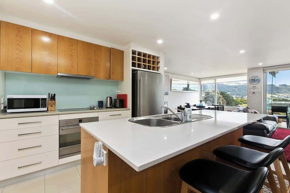 While preparing food, an open-plan kitchen allows you to see what is going on in the living area.

