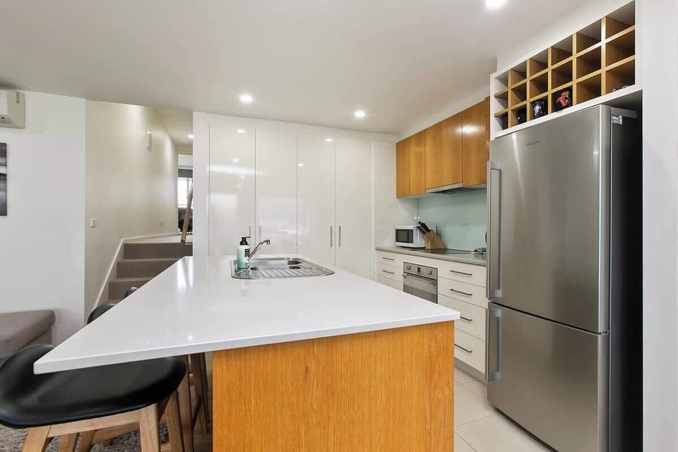 The kitchen is full of cutlery, tableware, spices, coffee and tea.
