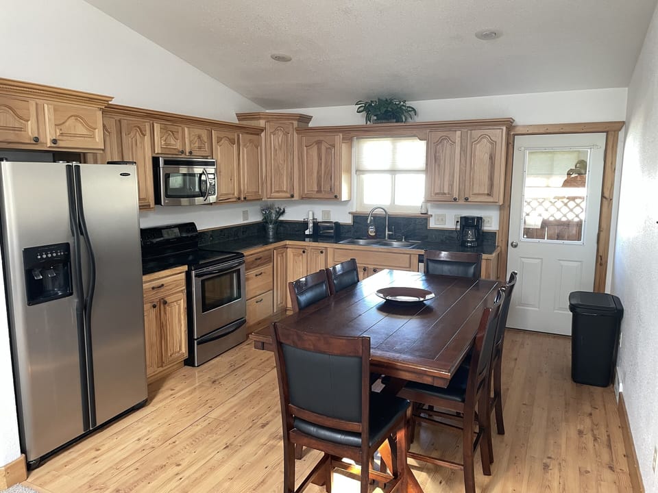 Seating for 6 with extra table and chairs in the closet.