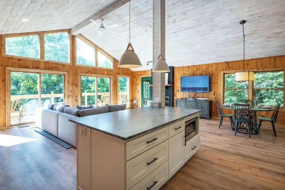 Open concept living and dining area are adjacent to kitchen.