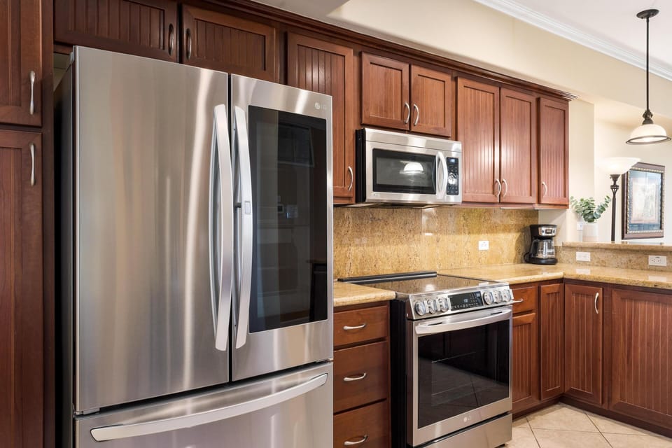 Full kitchen with granite countertops and stainless steel appliances