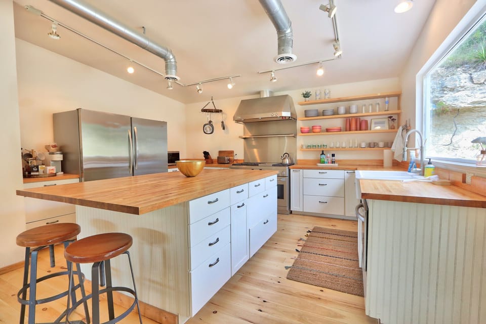 Full kitchen with stainless steel appliances