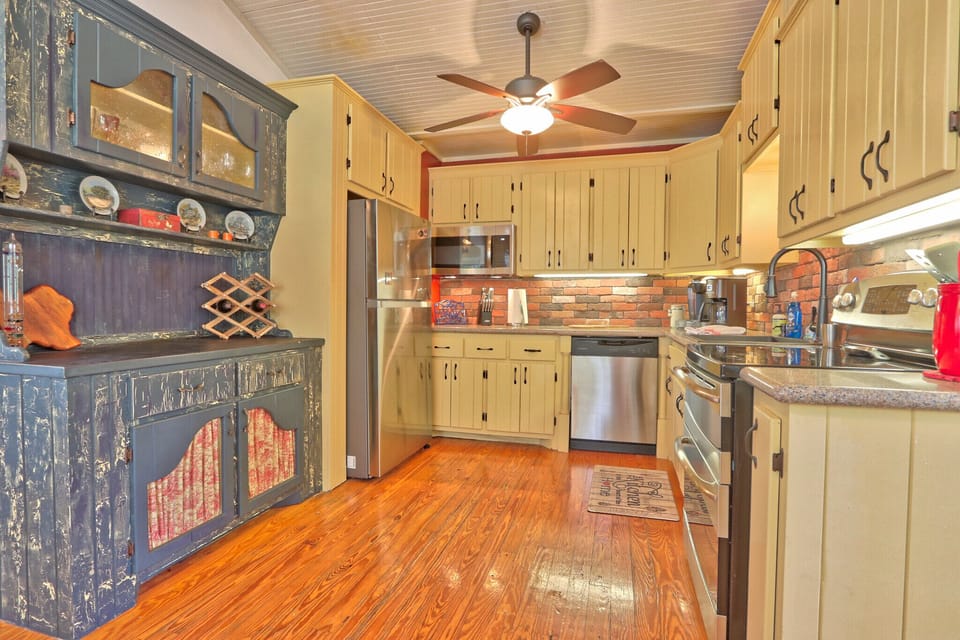 Full kitchen with stove, oven, dishwasher, microwave, refrigerator, and coffee maker