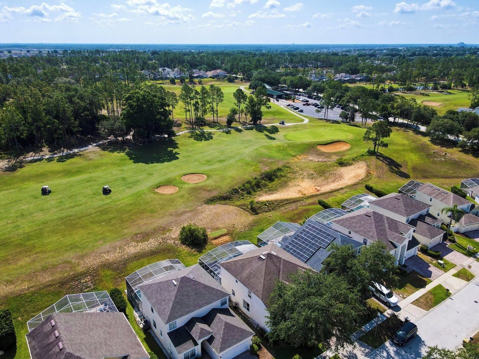 The backyard offers stunning views of your private pool, championship golf course, and resort clubhouse with incredible amenities like Lap Pool, Pickleball, Tennis, and Children's Playground.