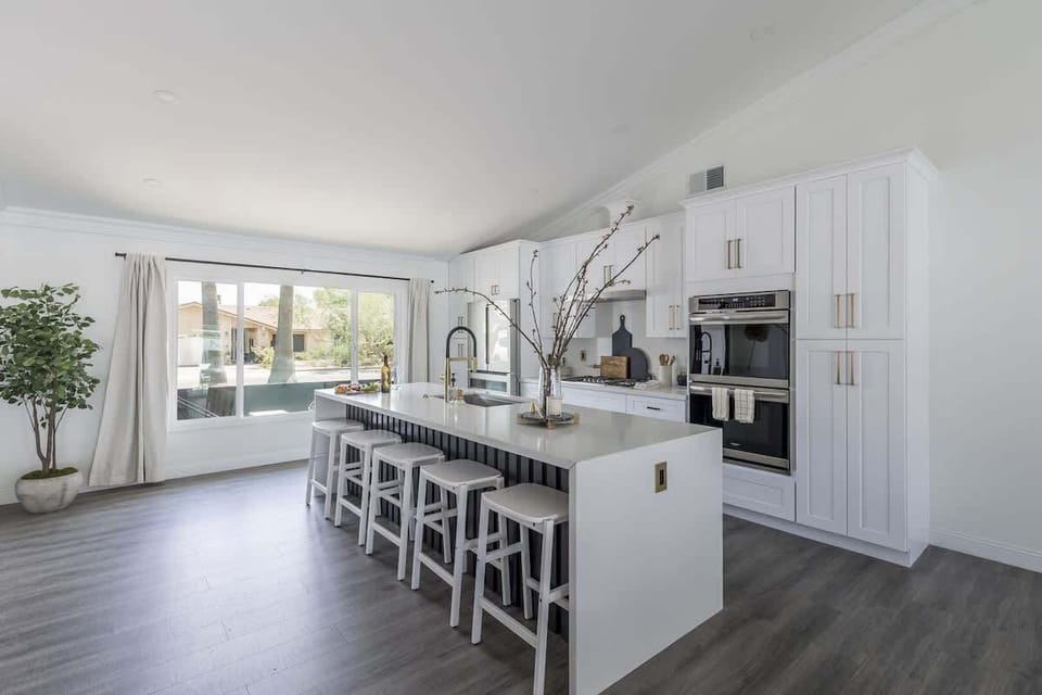 Full kitchen with island seating and stainless steel appliances