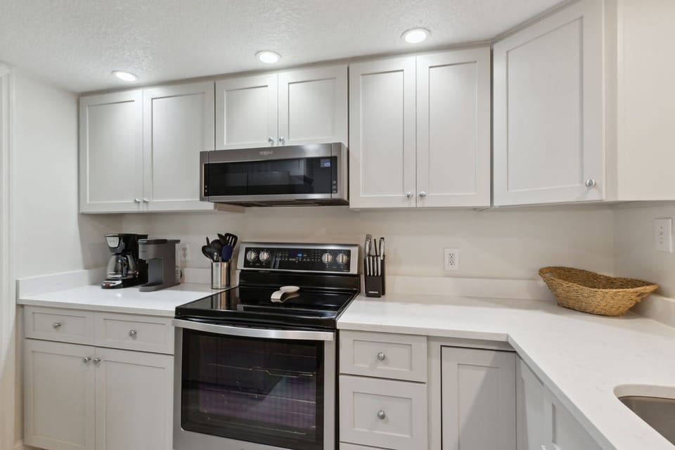 Updated Kitchen with Stainless Steel Appliances and Quartz Countertops