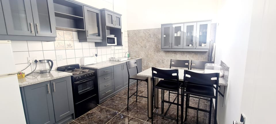 Honeymoon Apartment | Private kitchen | Full-size fridge, coffee/tea maker, electric kettle, cleaning supplies