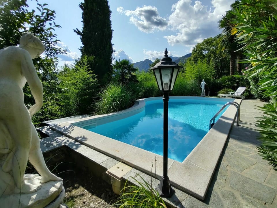 Water, Plant, Cloud, Sky, Swimming Pool, Tree, Shade, Leisure, Outdoor Furniture, Grass