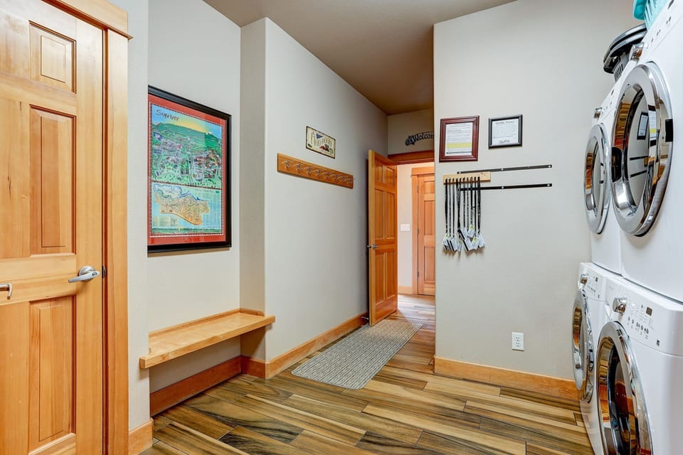 Laundry room with 2 washers and 2 dryers