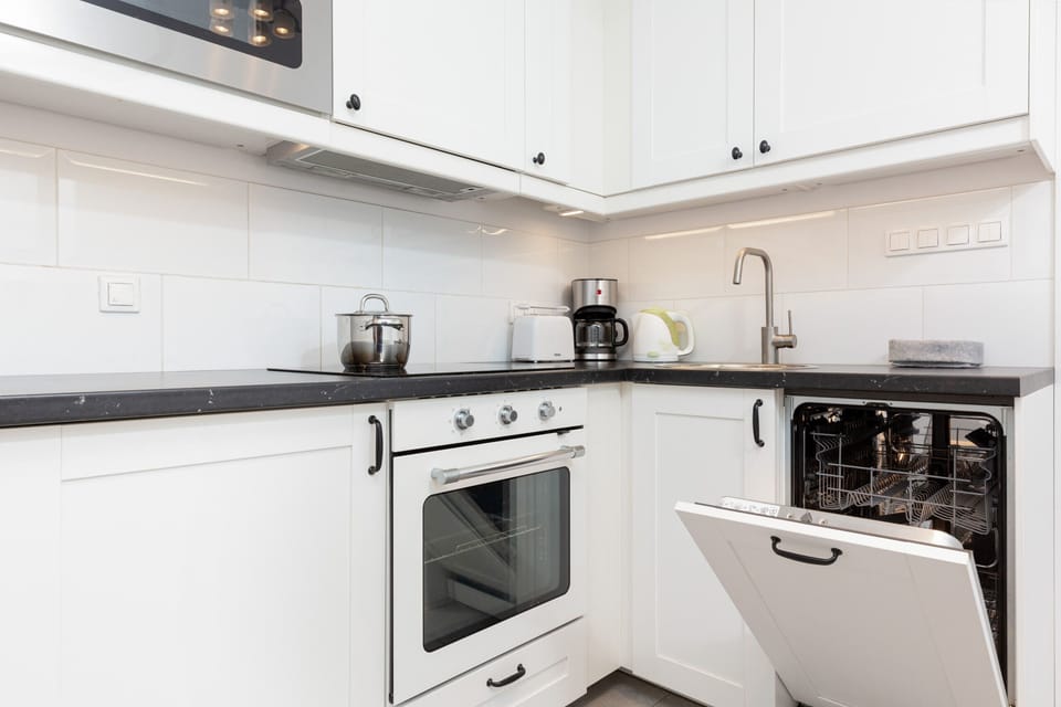 Bright kitchen with ample counter space and integrated appliances.
