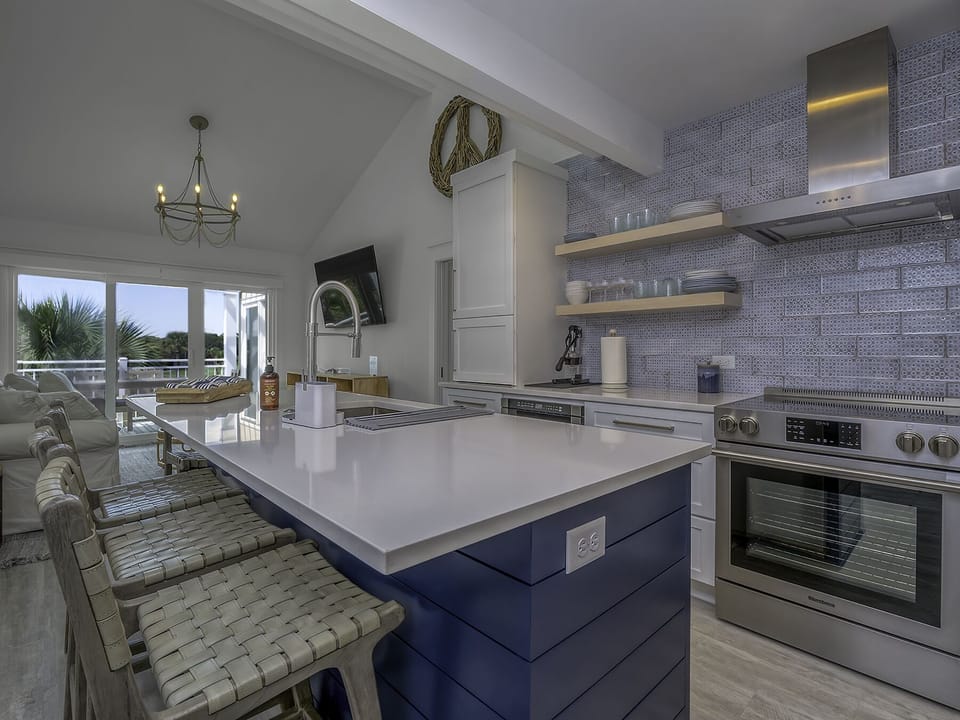 The beautiful kitchen with white cabinets is a perfect spot for meal preparation.
