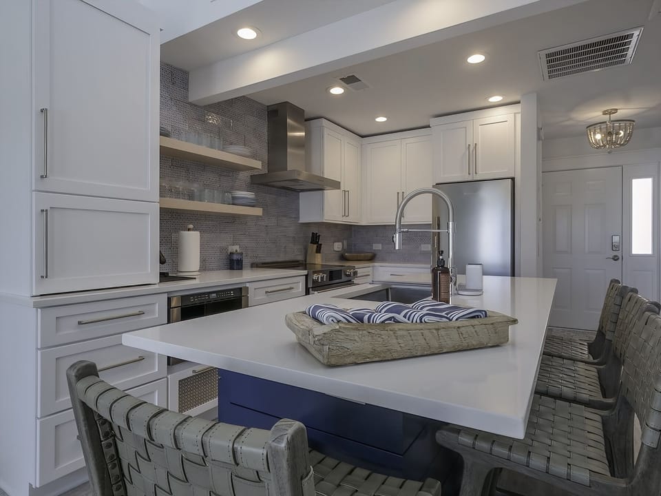 A large island with seating for four. The perfect gathering spot for meal preparation.