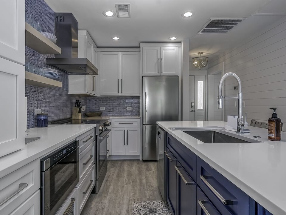 Subway tile backsplash and stainless steel appliances