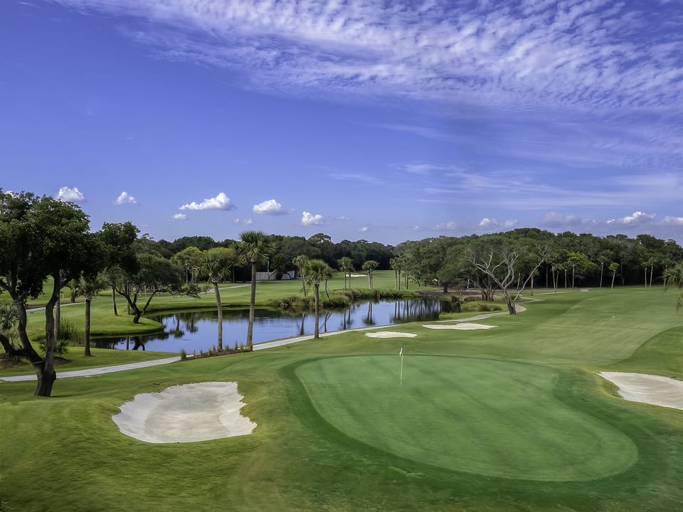 The putting green and surrounding ponds on the 18th hole.