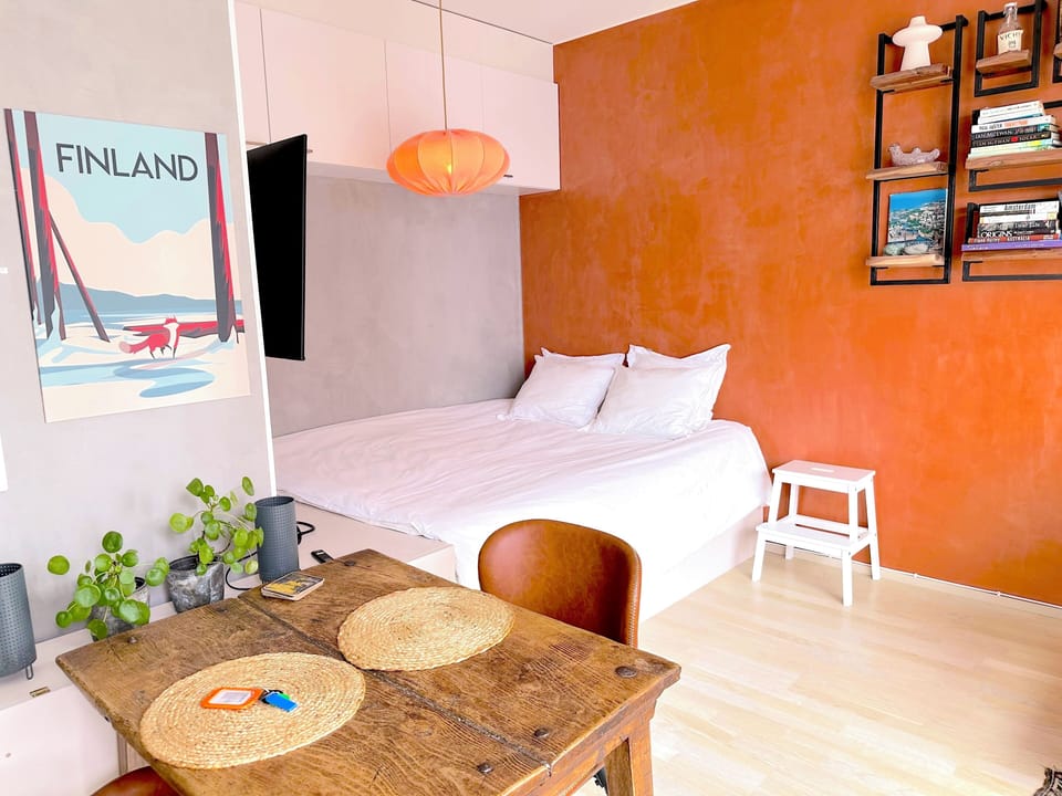 A comfortable bed and dining area