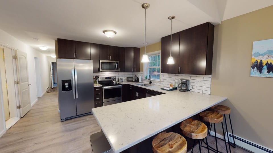 Kitchen with breakfast bar seating.