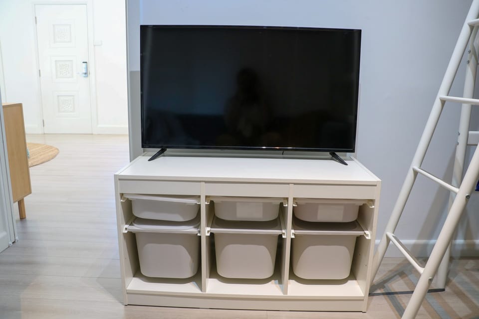 Storage bins under the TV in the Bunk Room are great for toys or clothes!