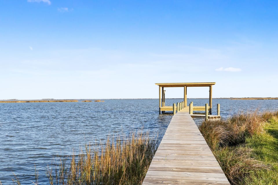 We provide a private canal, fishing pier & boathouse - you provide the fun!