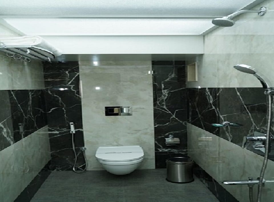 Shower, rainfall showerhead, designer toiletries, hair dryer