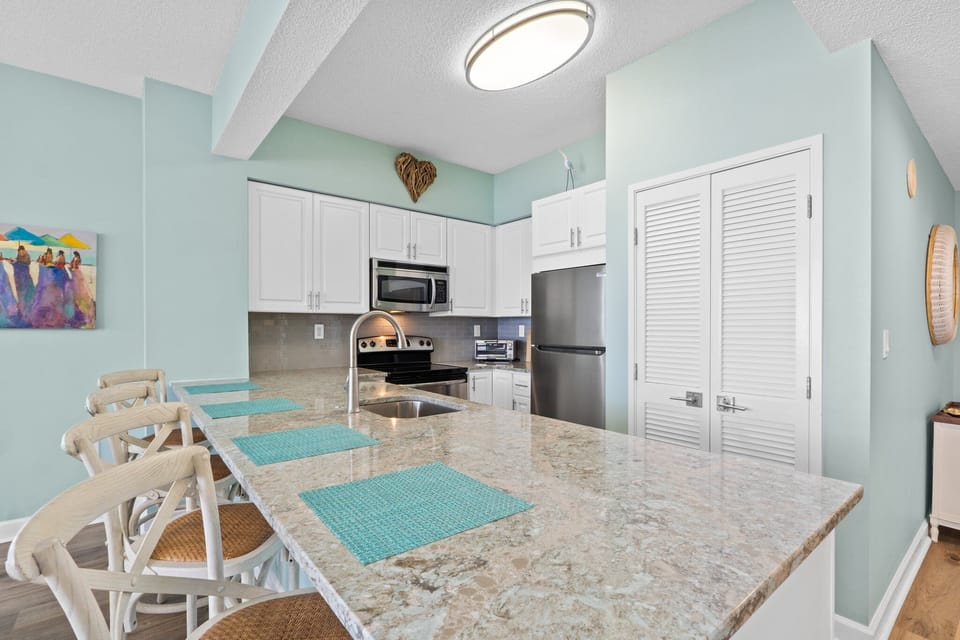 Enjoy the comfort of home with a fully equipped kitchen offering everything from major appliances to glassware, utensils, and bakeware. Whether you're preparing a feast or a quick snack, this kitchen has you covered.